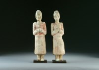 Lot 13 - A pair of pottery figures of attendants, Han...