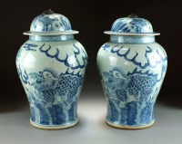 Lot 16 - A near pair of Chinese blue and white jars and...