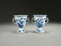 Lot 25 - A pair of Chinese blue and white footed cups,...