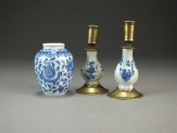 Lot 26 - A pair of small Chinese blue and white brass...