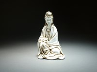 Lot 69 - A Chinese blanc de chine figure of Guanyin,...