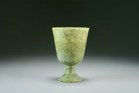 Lot 89 - A Chinese celadon green jade stem cup,...