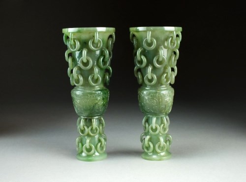 Lot 94 - A pair of jade Gu form vases, Qing Dynasty,...
