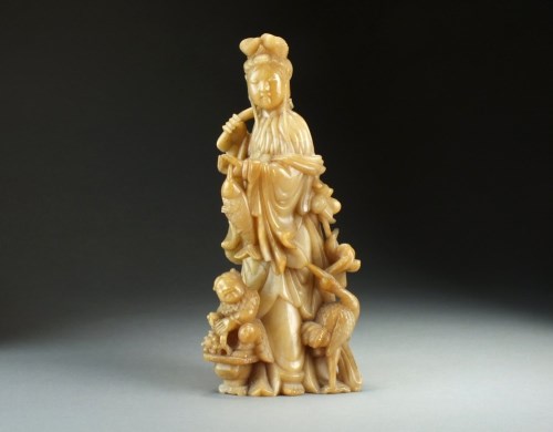 Lot 99 - A Chinese soapstone figure of Guanyin, 19th...