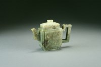 Lot 102 - A Chinese mid green jade teapot and cover,...