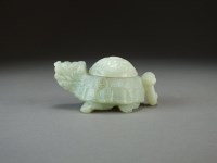 Lot 103 - A Chinese pale green Jade figure of a mythical...
