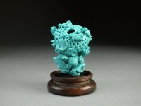 Lot 109 - A Chinese carved turquoise figure or brush...