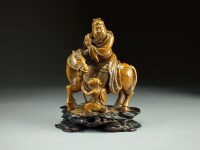 Lot 115 - A Chinese carved soapstone figure group, 19th...