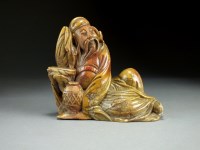 Lot 116 - A Chinese carved soapstone figure of an...