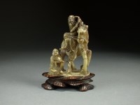 Lot 119 - A Chinese carved soapstone figure group, 19th...