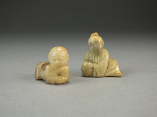 Lot 120 - Two small Chinese carved soapstone figures,...
