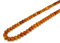 Lot 126 - An amber bead necklace, comprising...