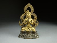 Lot 139 - A Sino-Tibetan gilt bronze figure of Marichi,...