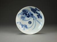 Lot 226 - A Japanese Nabeshima blue and white saucer...
