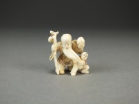 Lot 239 - A Japanese ivory netsuke of Shou Lao, modelled...