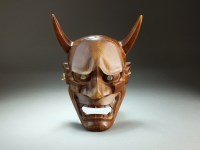 Lot 247 - A Japanese carved wood oni mask, Taisho period,...