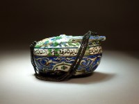 Lot 265 - A glazed earthenware kashkul, Persia, 19th...