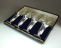 Lot 16 - A George V cased set of four silver mounted...