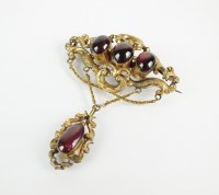 Lot 97 - A mid-19th century garnet set brooch, designed...