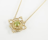 Lot 100 - An early 20th century peridot and seed pearl...