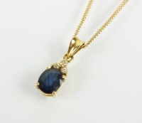 Lot 107 - A sapphire and diamond pendant, designed as an...