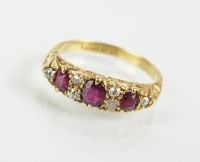 Lot 116 - An 18ct gold nine stone ruby and diamond ring,...