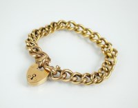 Lot 120 - A yellow metal hollow curb link bracelet, the...