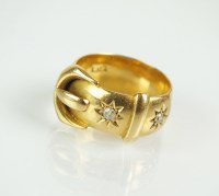 Lot 121 - An 18ct gold diamond set buckle ring,...