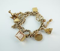 Lot 124 - A yellow metal double link bracelet with...