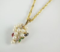 Lot 134 - A 9ct gold cultured pearl, diamond, ruby,...