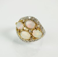 Lot 136 - An 18ct gold opal and diamond cluster ring,...