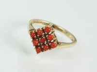 Lot 158 - A 9ct gold orange stone plaque ring, designed...