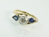 Lot 159 - A 9ct gold three stone diamond and sapphire...