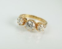 Lot 160 - A three stone graduated diamond ring, the...