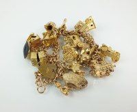 Lot 161 - A 9ct gold double link charm bracelet, with...