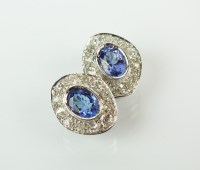 Lot 165 - A pair of tanzanite and diamond earrings, each...