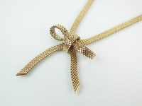 Lot 169 - A 9ct gold stylised bow necklace, the brick...