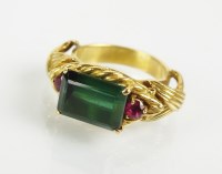 Lot 179 - A three stone tourmaline and ruby dress ring,...