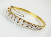 Lot 183 - A late 19th century moonstone and ruby hinged...