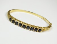 Lot 184 - An 18ct gold diamond and sapphire set hinged...