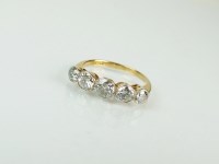 Lot 194 - A five stone graduated diamond ring, the five...