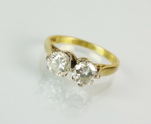 Lot 196 - A two stone diamond ring, the two brilliant...