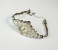 Lot 219 - A Lady's platinum and diamond set cocktail...