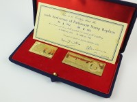 Lot 668 - A cased pair of 18ct gold stamp replicas to...