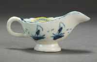 Lot 14 - A Caughley toy sauceboat painted in underglaze...