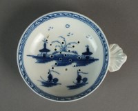 Lot 79 - A Caughley egg drainer painted with the Island...
