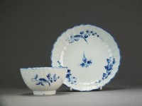 Lot 222 - A reeded Caughley tea bowl and saucer painted...