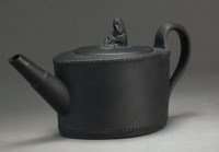 Lot 233 - A rare black basalt teapot and cover, circa...