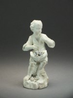 Lot 365 - A Derby biscuit porcelain model of a young boy...