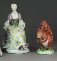 Lot 373 - A Derby porcelain figure of a seated lady...